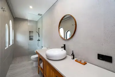 a bathroom with a sink and a mirror at Villa Loema in Kerobokan