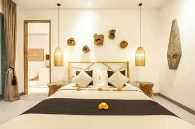 a bedroom with a large bed with oranges on it at Modern 4bd villa, amazing location in Seminyak in Seminyak