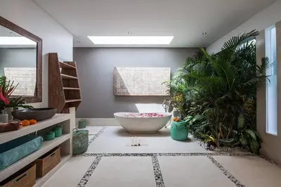 a bathroom with a large bowl on the floor with plants at Seminyak Luxueuse villa 2 chambres in Seminyak