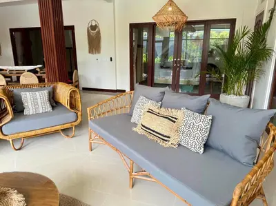 a couch with pillows on it in a living room at Villa AYLA - Legian - 5 Bedrooms - 5 Bathrooms in Seminyak