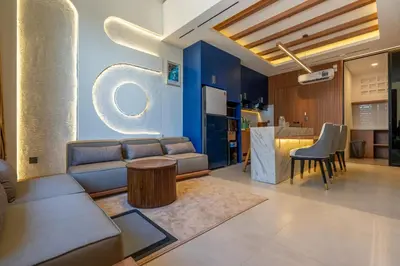 a living room with a couch and a table at 1BR Stylish Loft near airport in Pesanggaran