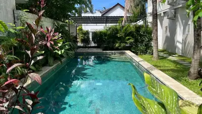 a swimming pool in the backyard of a house at Damai Suite Relax & Comfort in Canggu 3BR in Canggu