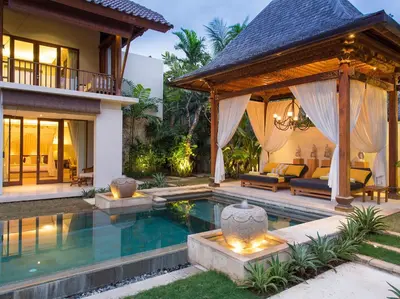 a villa with a swimming pool and a house at Villa Lilibel by Elite Havens in Seminyak