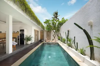 a swimming pool in the middle of a house at Stylish 2BR Villa in Seminyak with Private Pool in Seminyak