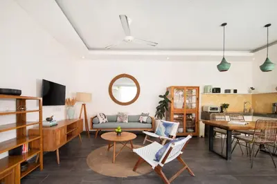 a living room with a couch and a table at Stylish 2BR Villa in Seminyak with Private Pool in Seminyak