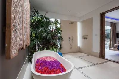 a bathroom with a tub filled with colorful sprinkles at Spacious 4 BR villa Seminyak garden and pool in Seminyak