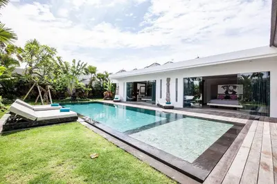 a swimming pool in the backyard of a villa at Seminyak Modern villa 4 BR fully serviced 5 in Seminyak