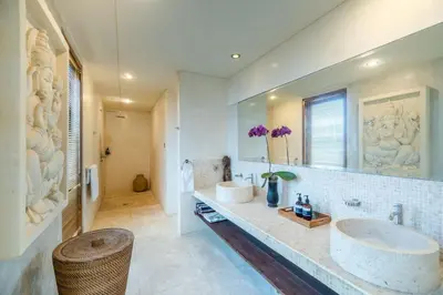 a bathroom with a sink and a large mirror at Tropical Villa Batik - Large Garden & Pool, Concierge! 3mins to Beach, Clubs, Cafes in Seminyak