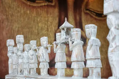a group of white statues with a clock on top at Amazing 4 BR villa with garden, pool in Seminyak in Seminyak