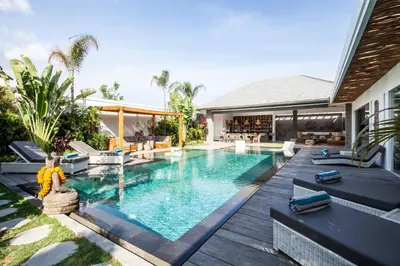 a swimming pool in the backyard of a house at Seminyak 5 bd villa avec Chill-out extérieur in Seminyak