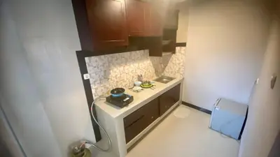 a small bathroom with a sink and a counter at Semilang House in Ngurah Rai International Airport
