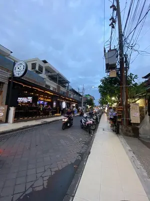 a group of motorcycles parked on a city street at Cozy room Kuta - 1 minutes to the beach by Micky Studio in Legian