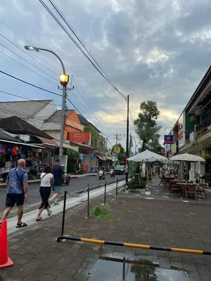 a street sign on the side of a city street at Cozy room Kuta - 1 minutes to the beach by Micky Studio in Legian