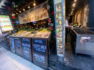a food stand with a counter with food on it at Cozy room Kuta - 1 minutes to the beach by Micky Studio in Legian