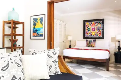 a bedroom with a bed and pillows at Beautiful 1 bedroom villa in perfect location in Seminyak