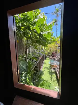 a window view of a garden from a patio at 1 BR Cozy Apartment in center of Seminyak in Seminyak