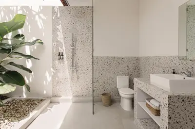 a bathroom with a shower and a toilet and a sink at 3 Bathroom Bali villa in Kerobokan