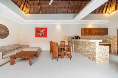 a living room with a couch and a table at Ben & B villa in Kerobokan
