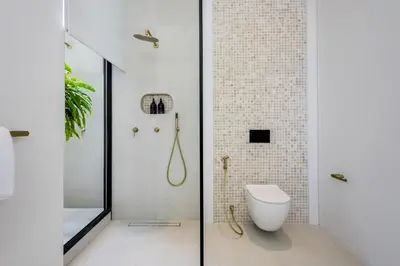 a bathroom with a shower and a toilet at Brand New Luxury5 Stars Designer By Villa Amare Villa 3 in Kerobokan