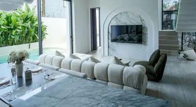 a living room with a couch and a table at Brand New Luxury5 Stars Designer By Villa-Amare Villa 1 in Kerobokan