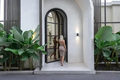 a woman walking into a door with a mannequin at Brand New Luxury5 Stars Designer By Villa-Amare Villa 5 in Kerobokan