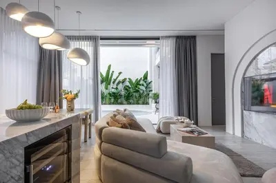 a living room with a couch and a table at Brand New Luxury5 Stars Designer By Villa-Amare Villa 5 in Kerobokan