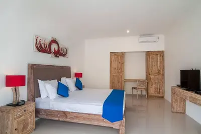a bedroom with a bed and a tv in it at 3BR Villa4 Oberoi Seminyak,18m walk to the beach in Seminyak