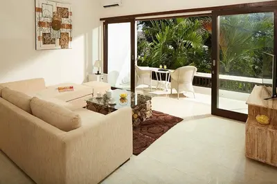 a living room with a couch and a table at 2BR Villa Central Seminyak,50 m walk to the beach in Seminyak
