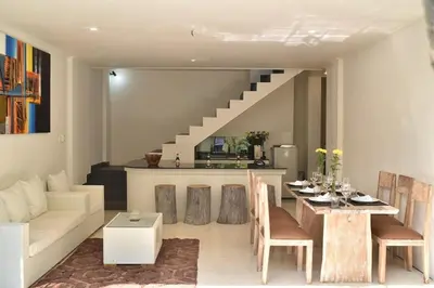 a living room with a couch and a table at 2BR Villa Central Seminyak,50 m walk to the beach in Seminyak