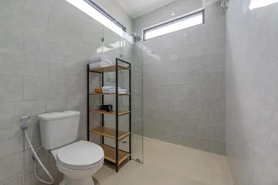 a bathroom with a toilet and a shower at Villa Fénix Brand New 1BR Villa in Umalas, Bali in Kerobokan