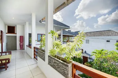 a balcony of a house with plants on it at Villa Langit Ocean View Jimbaran in Jimbaran