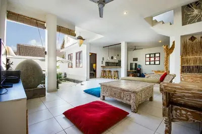 a living room with a couch and a table at Villa Langit Ocean View Jimbaran in Jimbaran