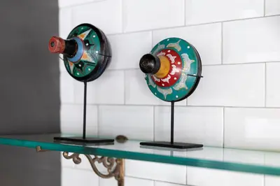 two plates on a glass shelf in a bathroom at Abby May - Top location near Potato Head, walk everywhere! in Seminyak