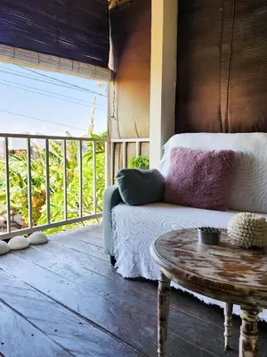 a living room with a couch and a coffee table at Serai House 2BR Cozy Kerobokan Home in Kerobokan