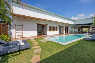 a house with a swimming pool in the yard at Villa Java by DreamAwayBali in Seminyak
