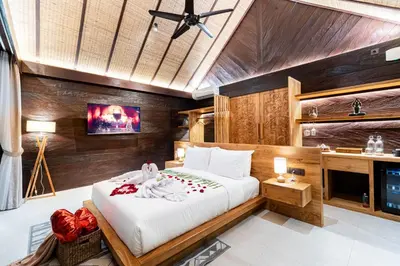 a bedroom with a large bed in a room at Villa Dijabu in Kuta