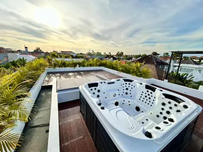a hot tub on the roof of a house at Villa Kawis Seminyak in Seminyak