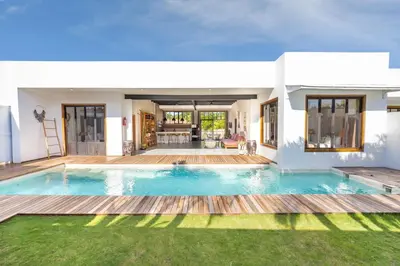 a swimming pool in the backyard of a house at Villa N'Zo By DreamAwayBali in Seminyak