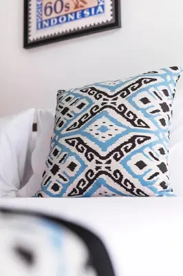 a pillow sitting on a chair in a room at Ti - 1BR pool villa in the heart of Seminyak in Seminyak