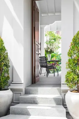 an internal rendering of a porch with chairs and a table at Ti - 1BR pool villa in the heart of Seminyak in Seminyak