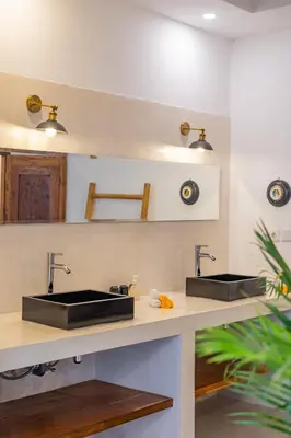 two sinks on a counter in a kitchen at Villa Wuizy By DreamAwayBali in Seminyak