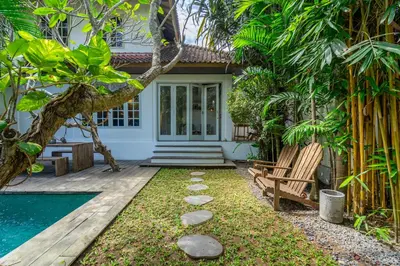 a backyard with a pool and a house at 2BR Villa in Umalas next to Seminyak & Canggu in Kerobokan