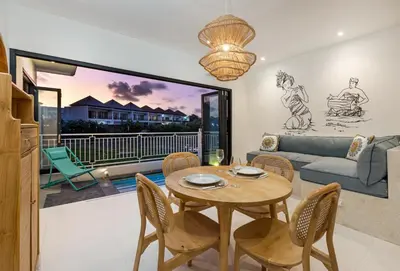 a living room with a table and chairs at NEW! Villa Theo - 1BR Villa in Kerobokan in Seminyak