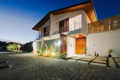 a house with a cobblestone street in front of it at Casa De Vero Amore in Jimbaran