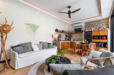 a living room with a couch and a table at Tropical 2BR Villa with Private Pool in Canggu in Canggu