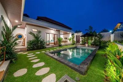 a house with a swimming pool in the yard at Nooky 4 - Villa with Spectacular Views in Kerobokan