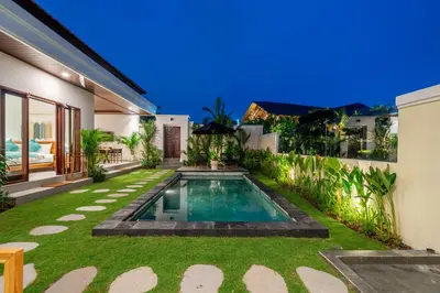 a swimming pool in the backyard of a house at Nooky 4 - Villa with Spectacular Views in Kerobokan