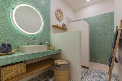 a bathroom with a sink and a mirror at Villa Jazz 3BR 10m Pool seminyak in Seminyak