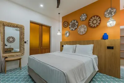 a bedroom with a large bed and a mirror at Villa Jinjah Soul Luxury 5BR Villa,18m Pool & Garden in Seminyak