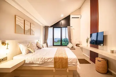 a bedroom with a large bed and a large window at Renjana Villa-2BR Modern Tropical Villa in Seminyak with Private Pool & Rice Field View in Seminyak